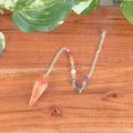 7 Chakra Faceted Carnelian Pendulum